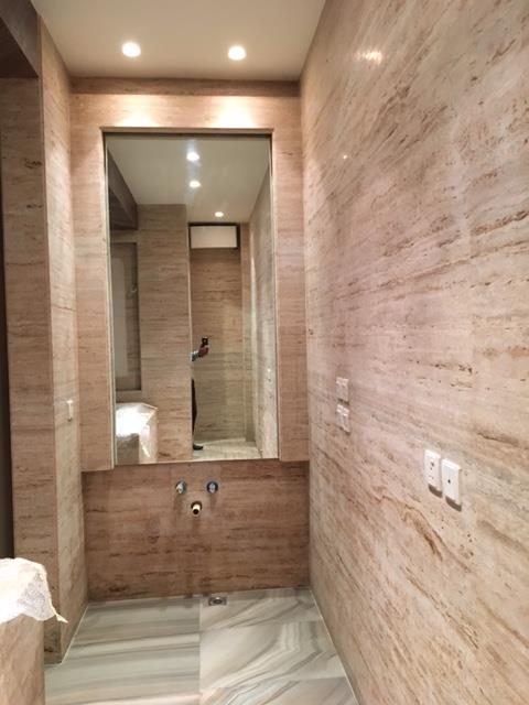 Bathroom 6 — Onyx stone with bookmatched veining and recessed cove lighting — Maharani Bagh Residence